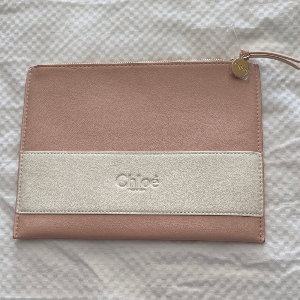 In the Tray of posh show!
NWOT Chloé perfume Pink and White cosmetic bag